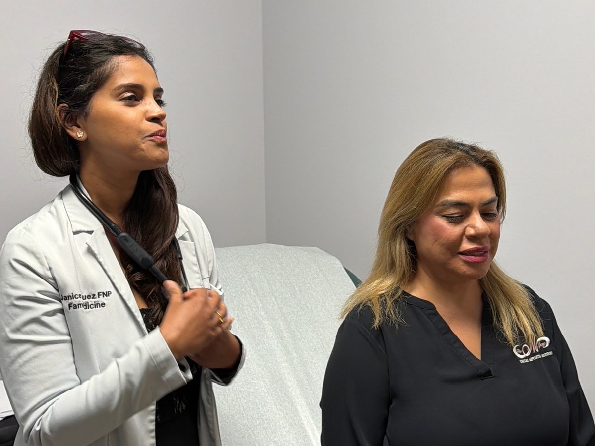 A nurse practitioner talking with a patient at Transmountain Primary Care in El Paso
