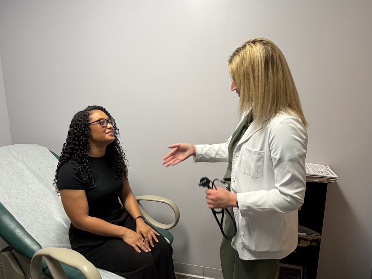 A provider welcoming a patient in an exam room at Transmountain Primary Care in El Paso